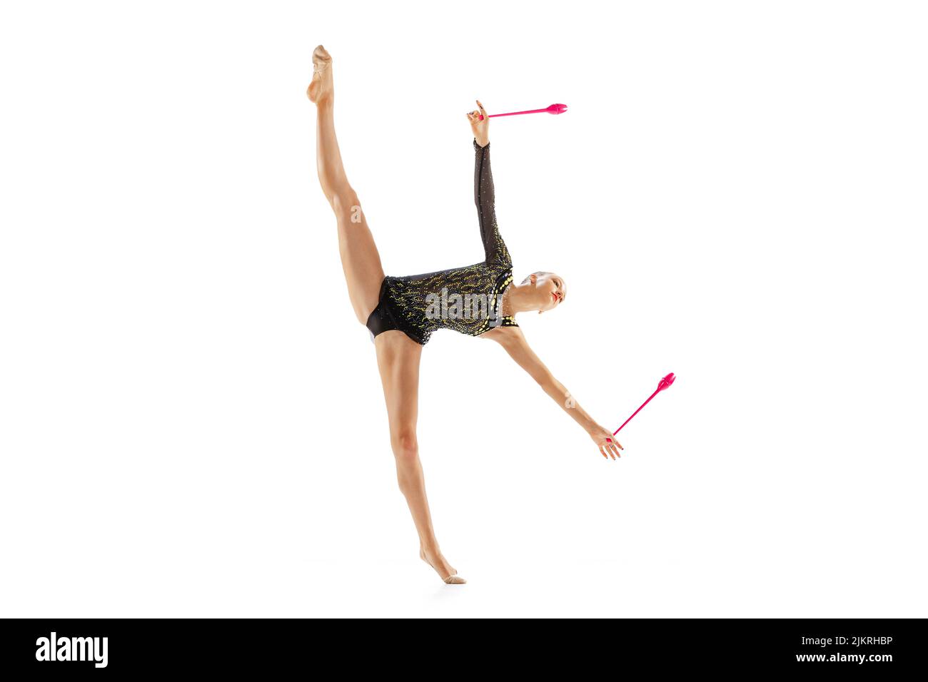 Portrait of young girl, female rhythmic gymnast training with clubs