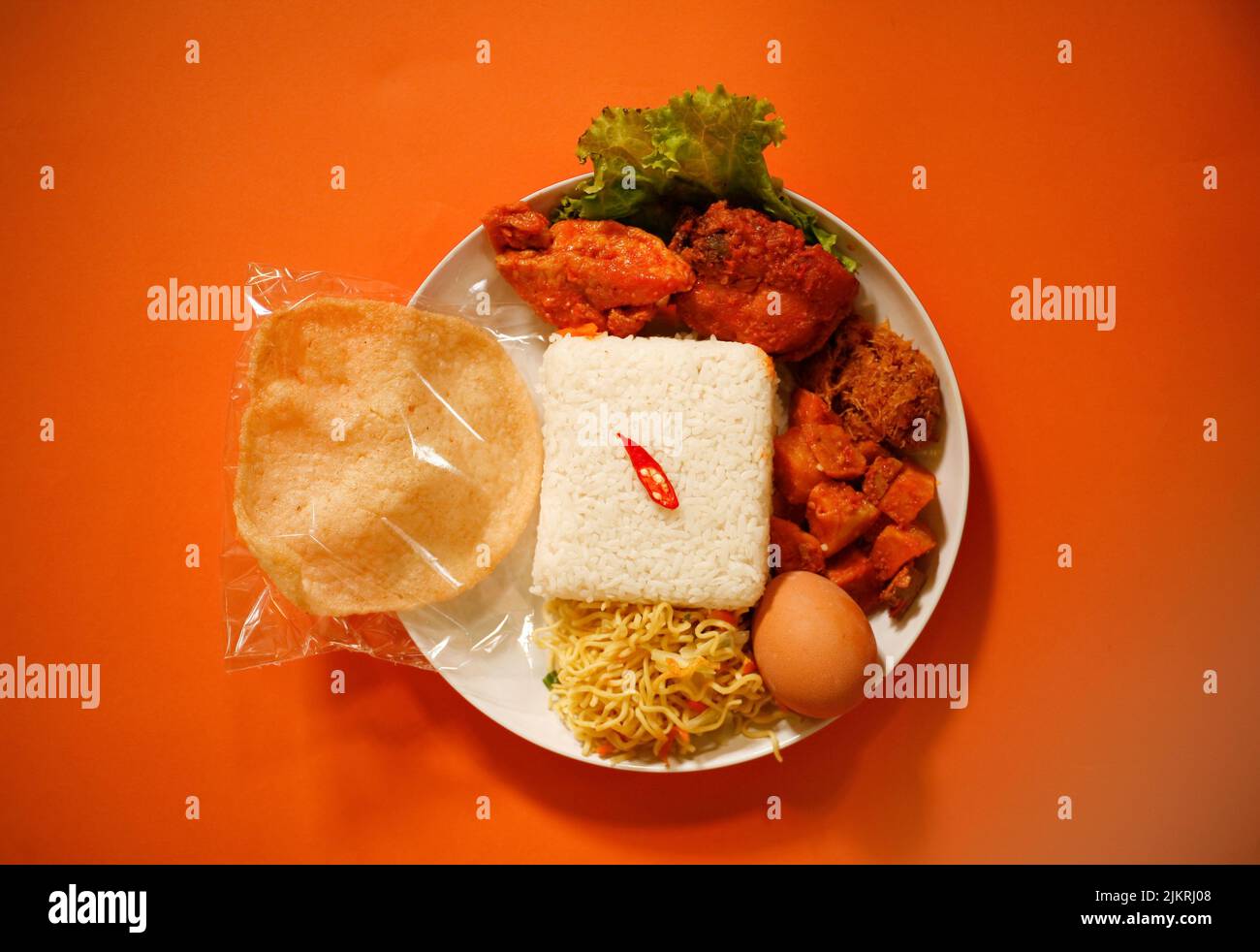 Rice Box or Indonesian lunch box with chicken meat, tofu, spicy potato