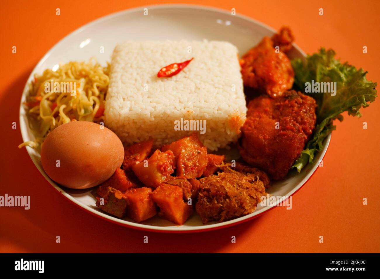 Rice Box or Indonesian lunch box with chicken meat, tofu, spicy potato