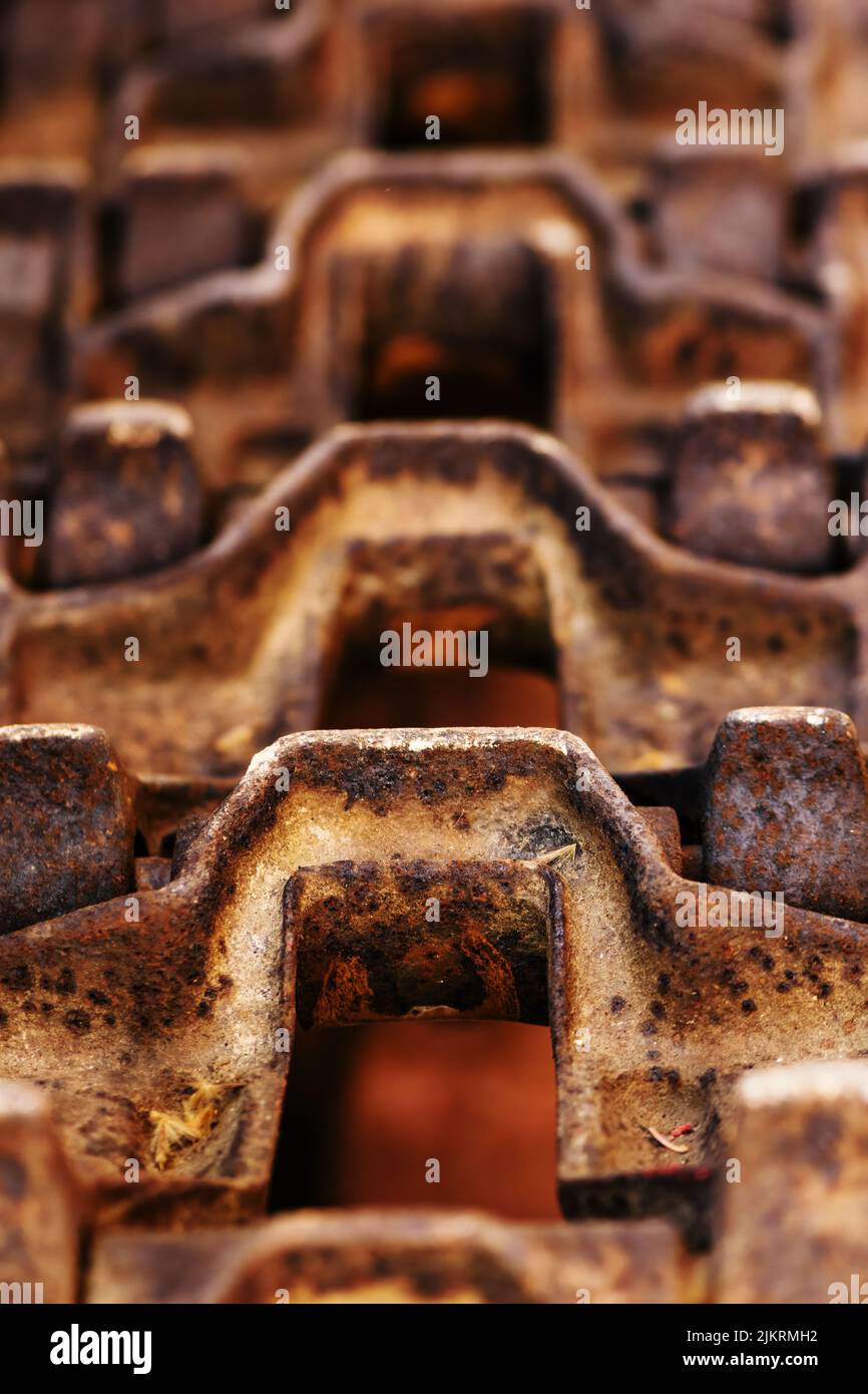 Old rusty crawler tractor tracks, closeup with selective focus Stock Photo