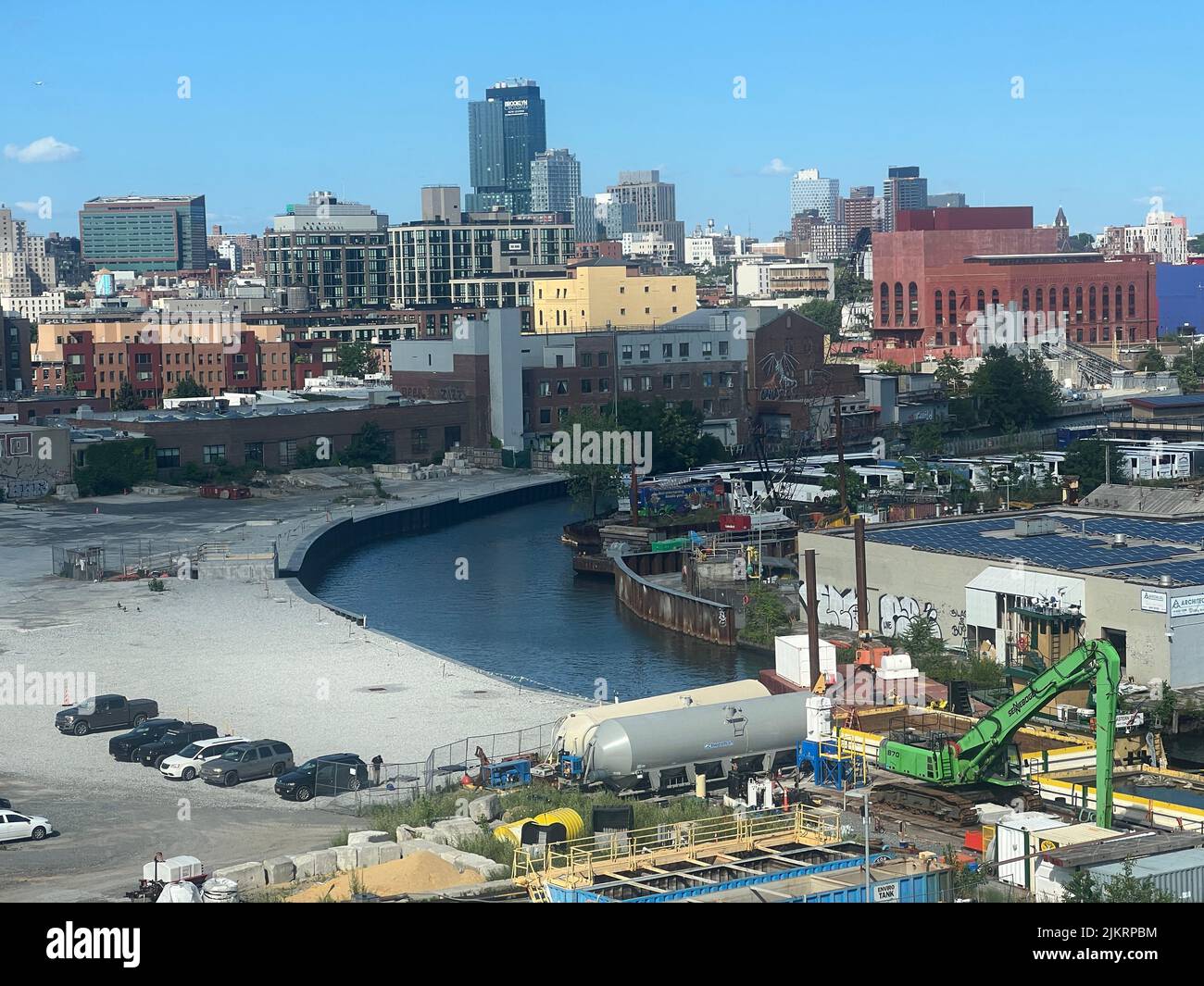 Gowanus Canal industrial neighborhood with still growing commercial and residential Brooklyn obvious in the background. Stock Photo
