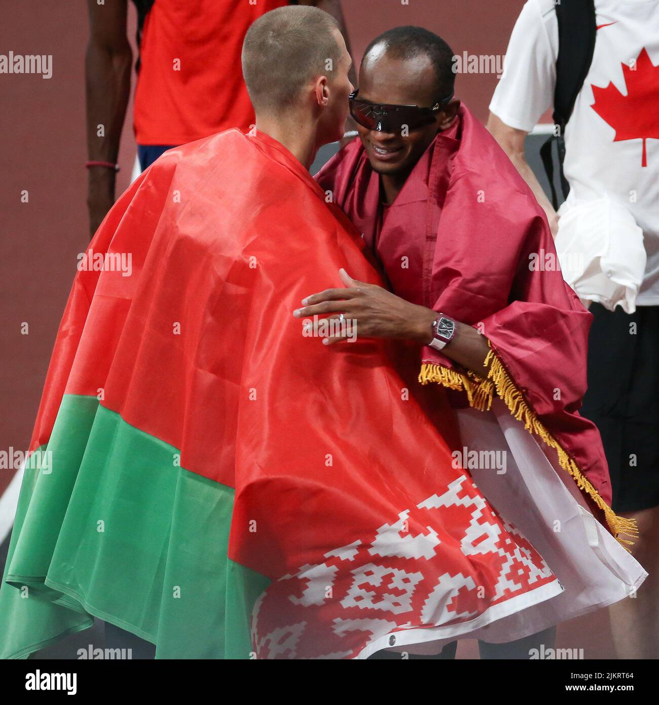 August 01st, 2021 - Tokyo, Japan: Maksim Nedasekau of Belarus congratulates Mutaz Essa Barshim of Qatar as he won the shared Gold Medal in the Men's H Stock Photo