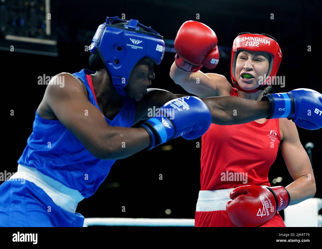 Australia's Kaye Frances Scott (right) on her way to victory in the Women's Over 66kg-70kg (Light Middle) - Quarter-Final 2 bout against Sierra Leone's Zainab Keita at The NEC on day six of the 2022 Commonwealth Games in Birmingham. Picture date: Wednesday August 3, 2022. Stock Photo