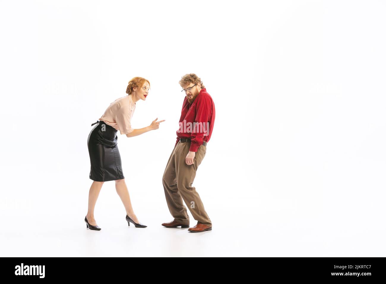 Family couple in vintage outfits sort things out isolated on white background. Concept of relationship, family, feminism, psychology of personality Stock Photo