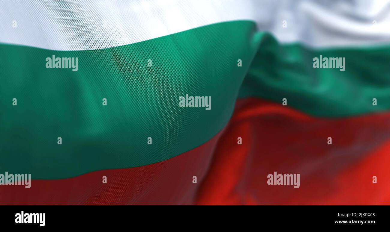 Close-up view of the Bulgarian national flag waving in the wind. Bulgaria is a country in Southeast Europe. Fabric textured background. Selective focu Stock Photo