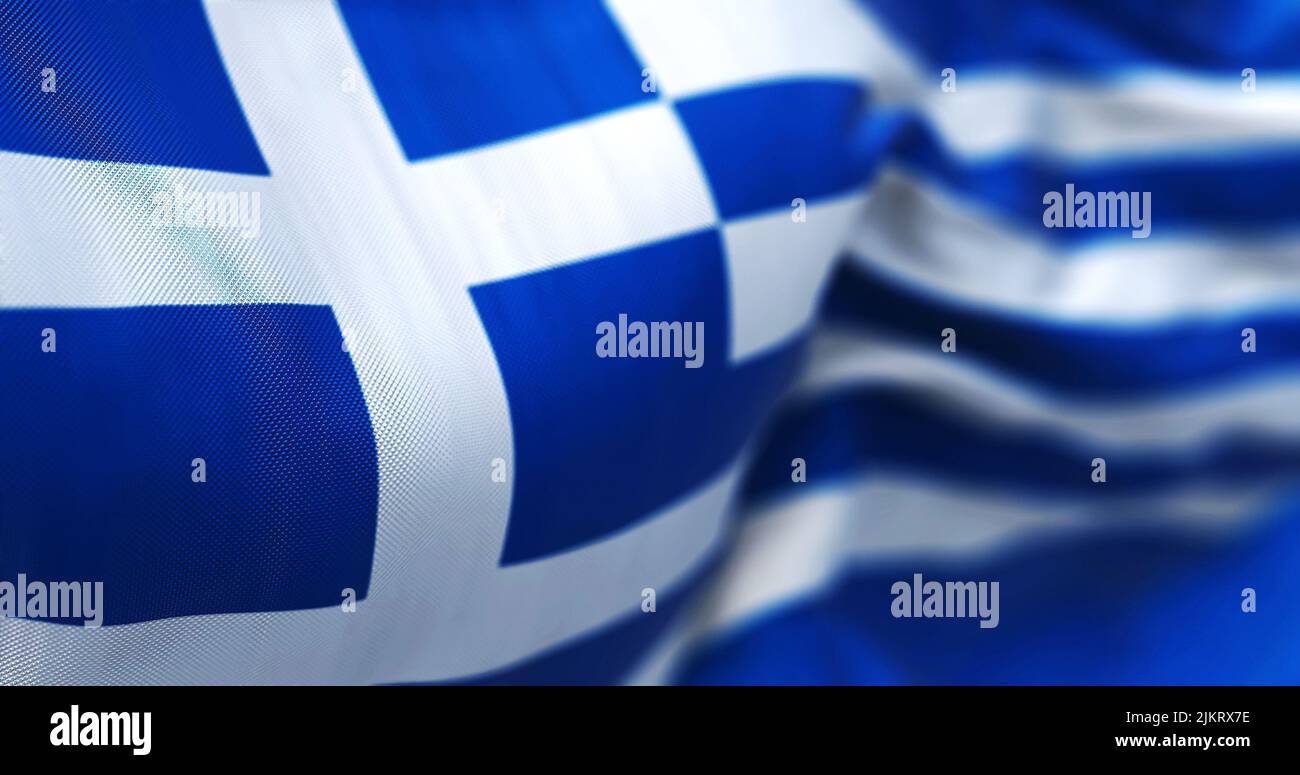 Close-up view of the greek national flag waving in the wind. Greece is a country at the crossroads of Central and Southeast Europe. Fabric textured ba Stock Photo