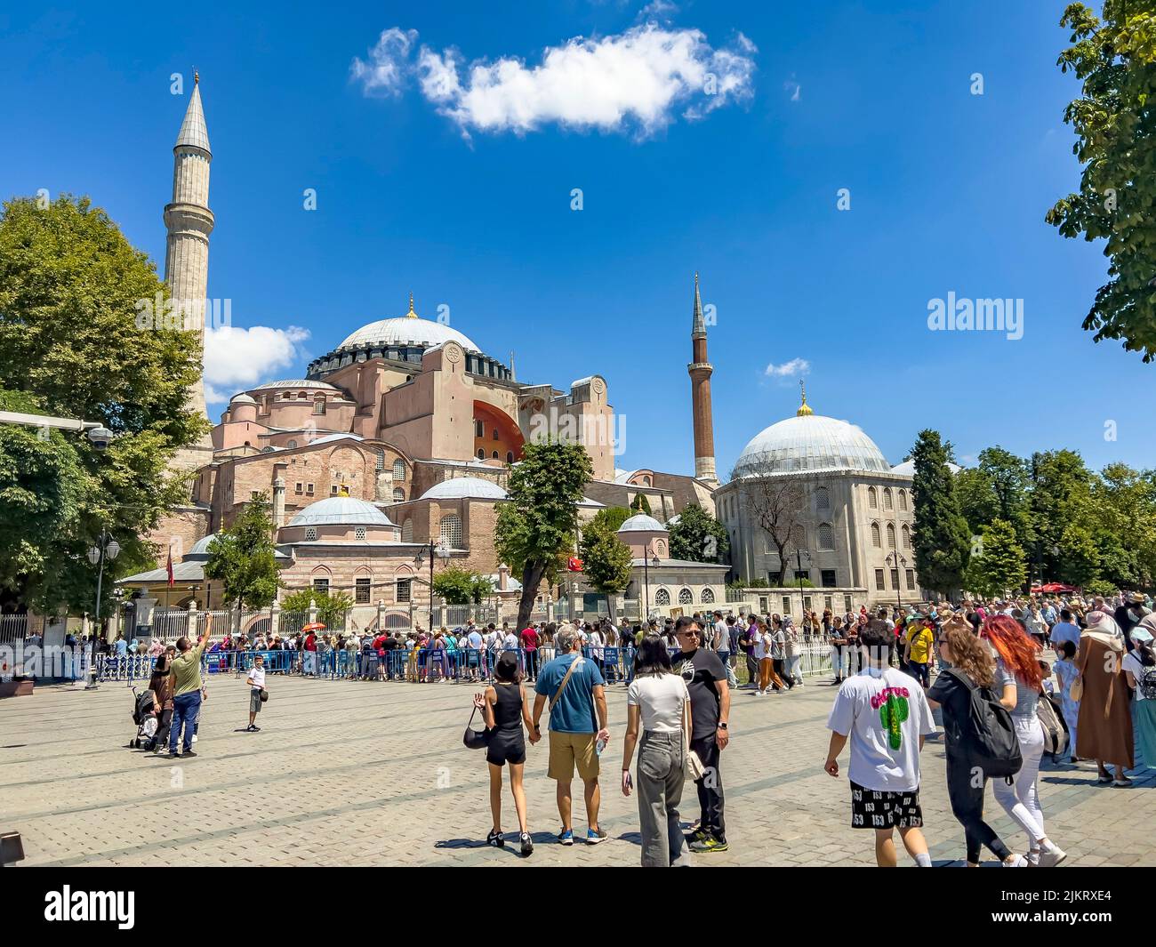 Istanbul - Turkey - July 14, 2022: International tourist crowds standing in queue to visit the magnificent and beautiful Hagia Sophia church, museum, Stock Photo