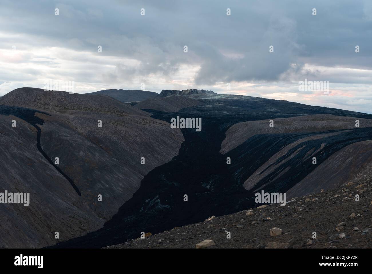 Smoke rising over the Fagradsfjall volcanic area in Reykjanes peninsula