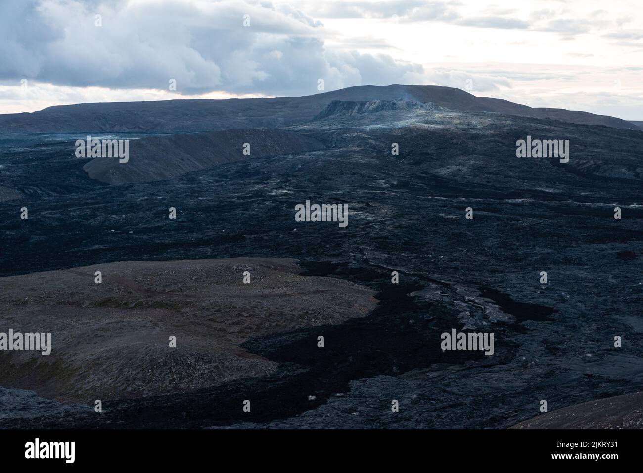Smoke rising over the Fagradsfjall volcanic area in Reykjanes peninsula