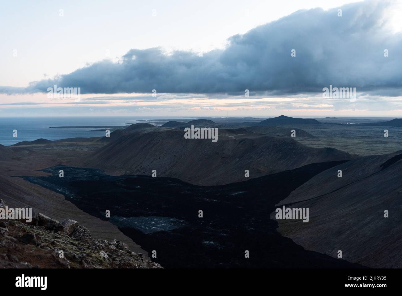 Smoke rising over the Fagradsfjall volcanic area in Reykjanes peninsula