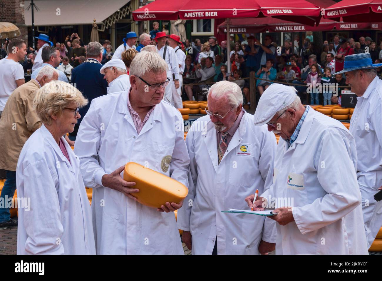 the testers check the quality of the cheese on the cheese market in holland in Alkmaar Stock Photo