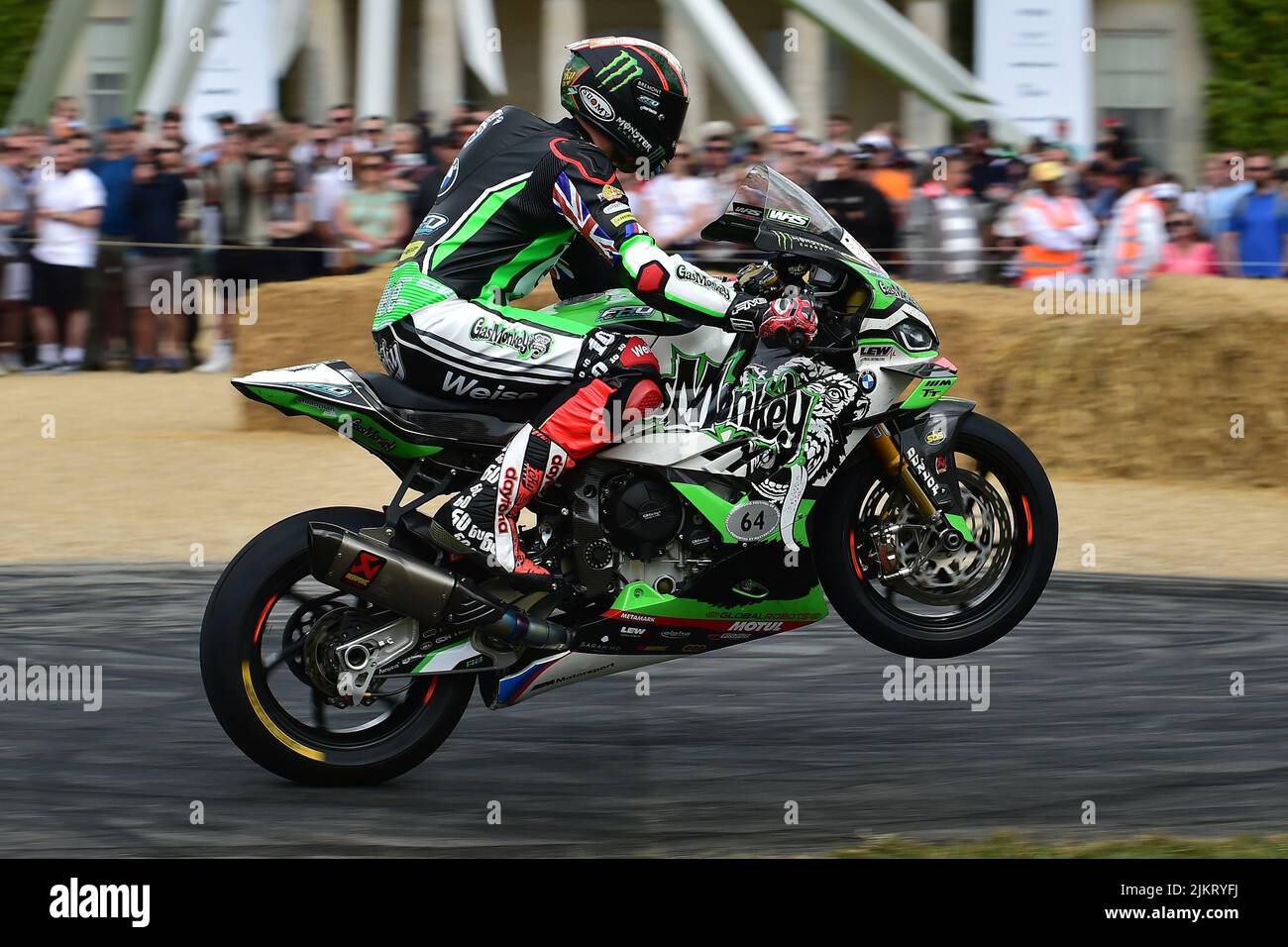 Pulling a wheelie past the house, Peter Hickman, BMW Gas Monkey, FHO Racing BMW, Contemporary Racing Motorcycles, current solo racing motorcycles and Stock Photo