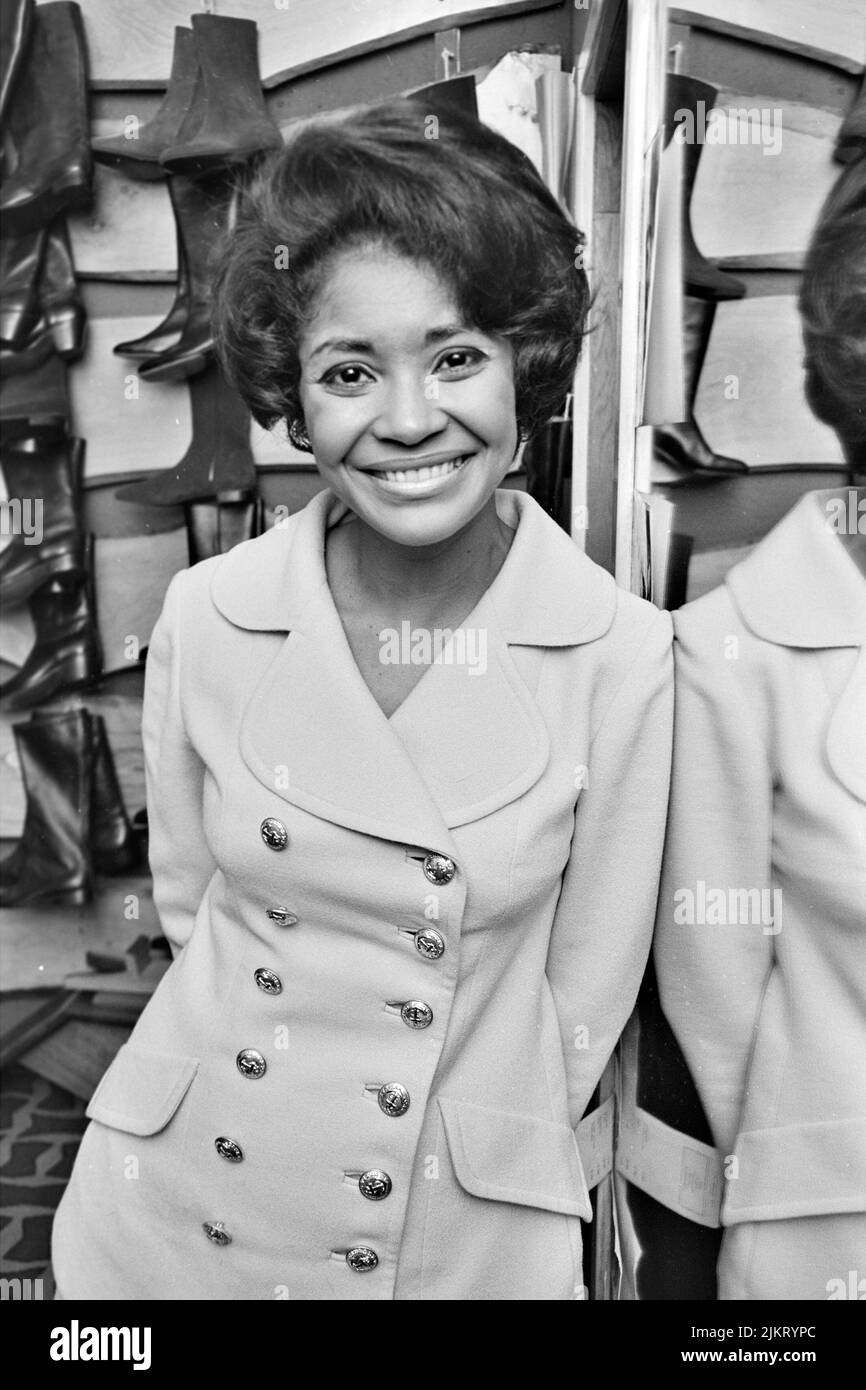 NANCY WILSON (19372018) American singer shopping for boots on Oxford Street, London, in