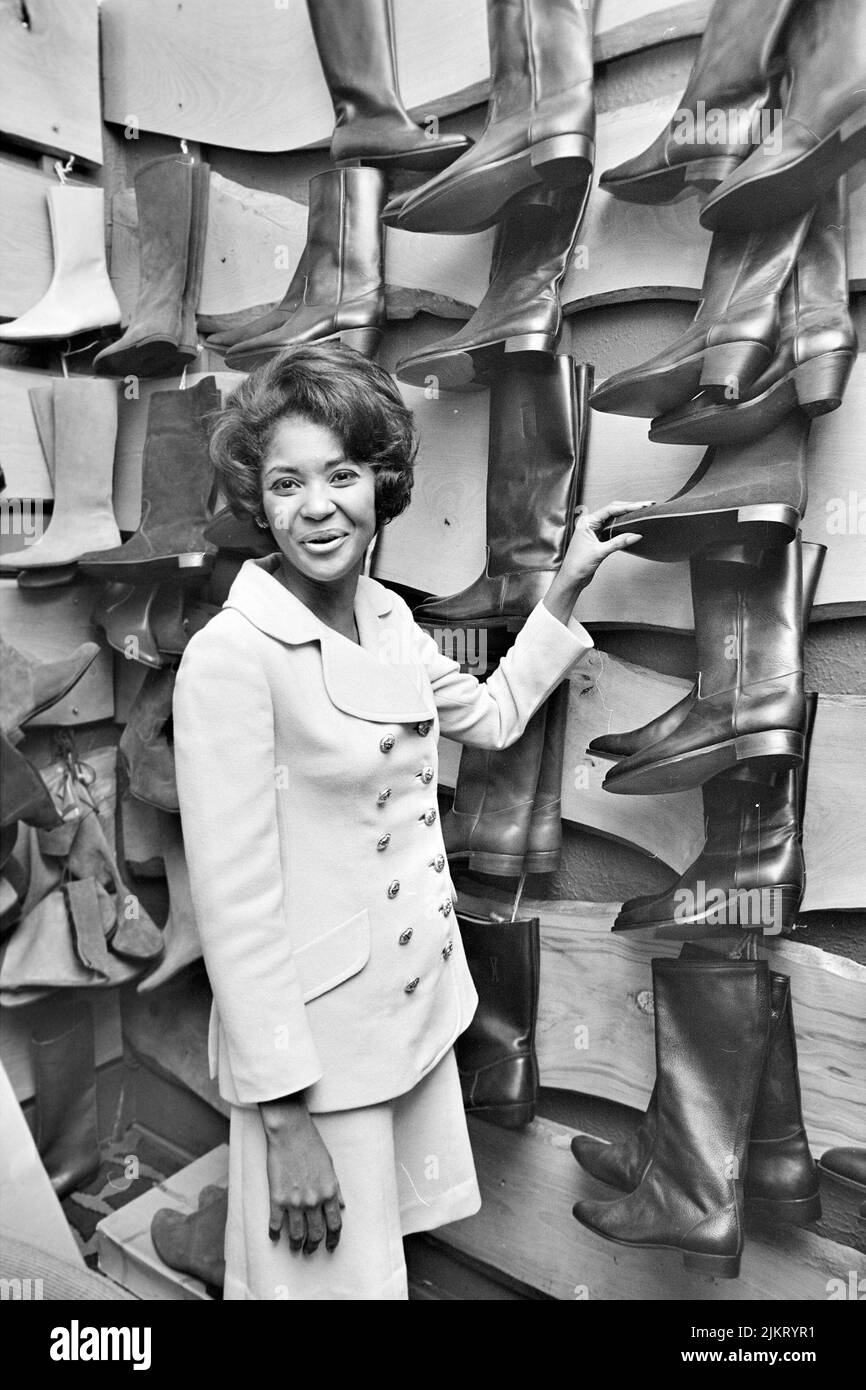 NANCY WILSON (19372018) American singer shopping for boots on Oxford Street, London, in