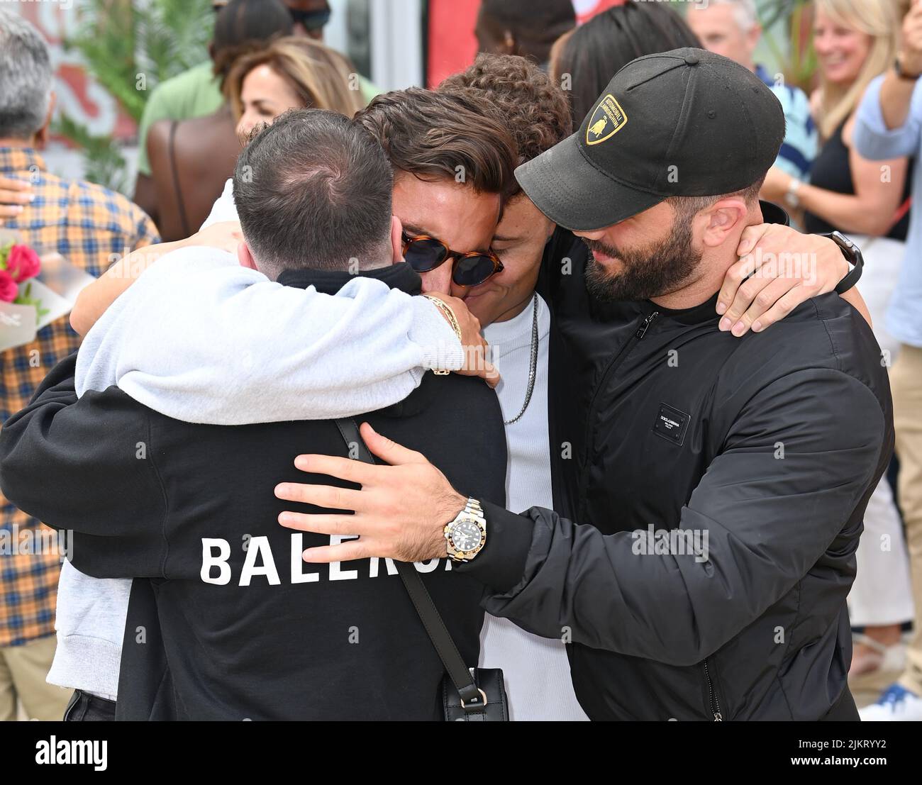 Stansted, UK. 03rd Aug, 2022. August 3rd, 2022. London, UK. Davide Sanclimenti, winner of Love Island 2022 with friends and family at Stansted Airport. Credit: Doug Peters/Alamy Live News Stock Photo