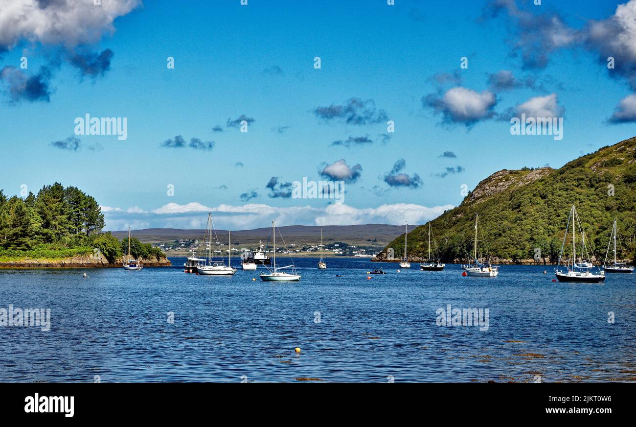BADACHRO ROSS AND CROMARTY SCOTLAND THE BAY WITH MANY MOORED YACHTS WITH GAIRLOCH HOUSES IN THE DISTANCE Stock Photo