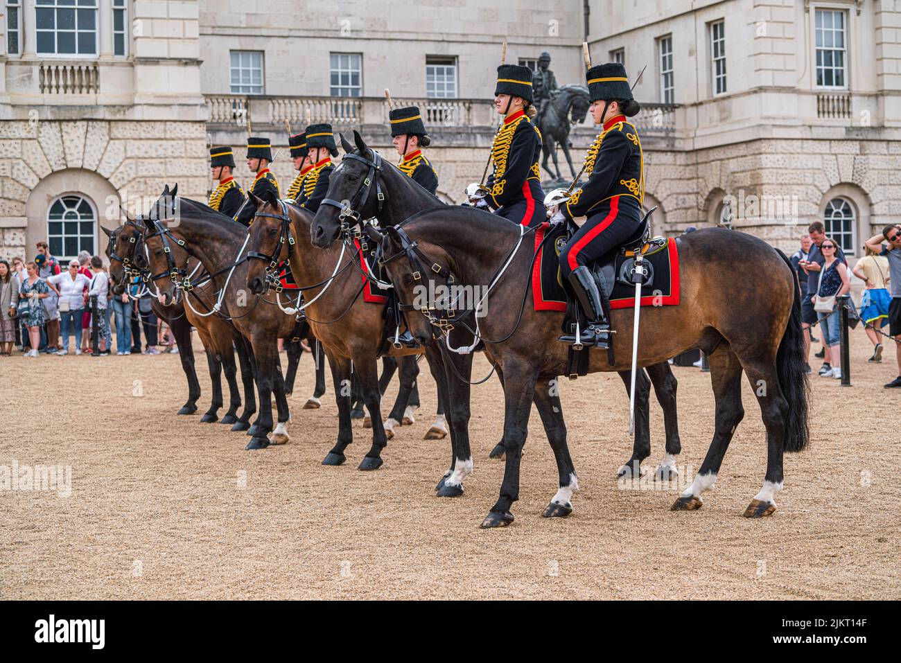 London, UK 3 August 2022. Members of the Kings Troop Royal  Horse Artillery  wearing gold braided uniforms and busby hats ride down the mall towards horse guards parade during the changing of the guards ceremony on a hot and humid day in London Credit. amer ghazzal/Alamy Live News Stock Photo