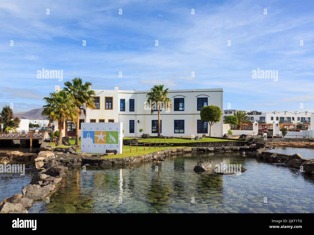 Gardens and sign in coastal resort of Marina Rubicon, Playa Blanca, Lanzarote, Canary Islands, Spain, Europe. Stock Photo
