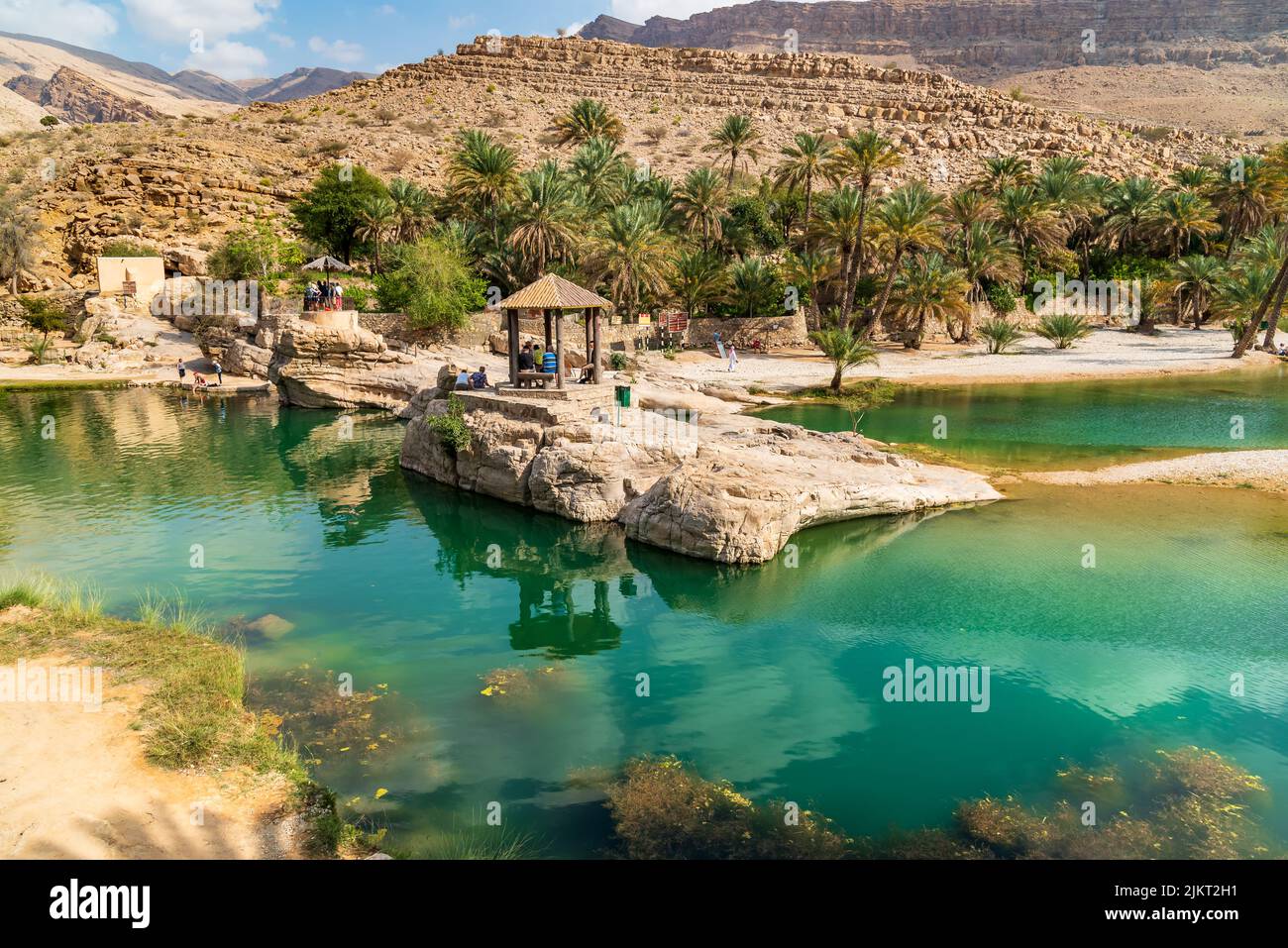View of the Wadi Bani Khalid oasis in the desert in Sultanate of Oman. Stock Photo