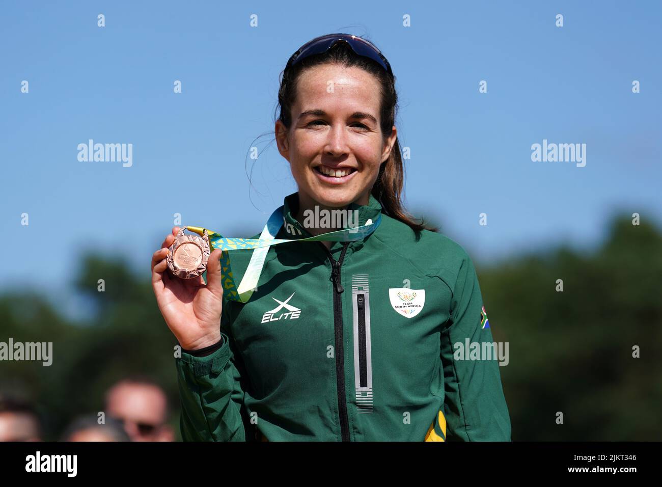 South Africa's Candice Lill celebrates on the podium with her bronze medal she won in the Women's Cross-country final at Cannock Chase on day six of the 2022 Commonwealth Games. Picture date: Wednesday August 3, 2022. Stock Photo