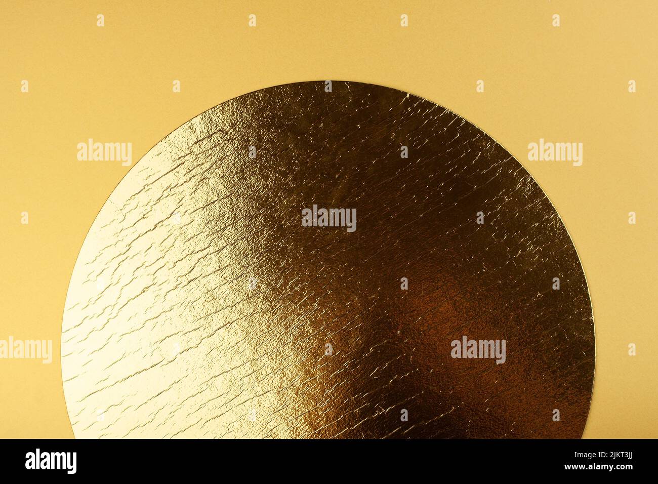 Golden circle on a yellow background. Stock Photo
