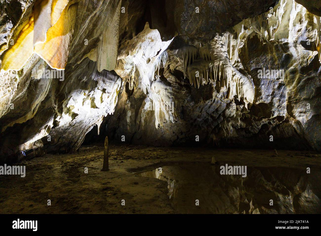 Cave with stalactites and stalagmites. The geological formation of ...