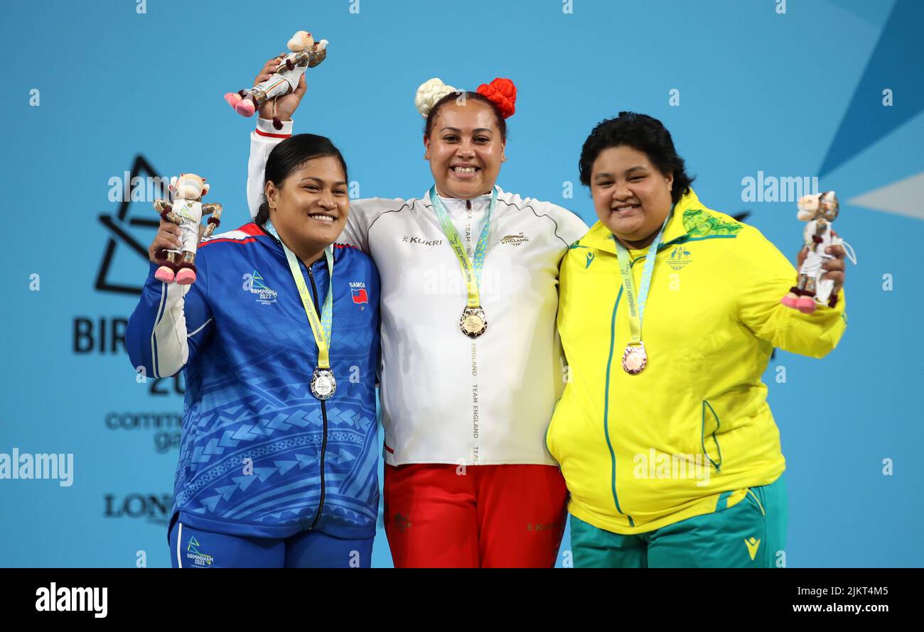 England's Emily Campbell (centre) poses with her gold medal after winning the Women's 87+ KG Final alongside second placed Samoa's Feagaiga Stowers with her silver medal and third placed Australia's Charisma Amoe Tarrant (right) with her bronze medal at The NEC on day six of the 2022 Commonwealth Games in Birmingham. Picture date: Wednesday August 3, 2022. Stock Photo