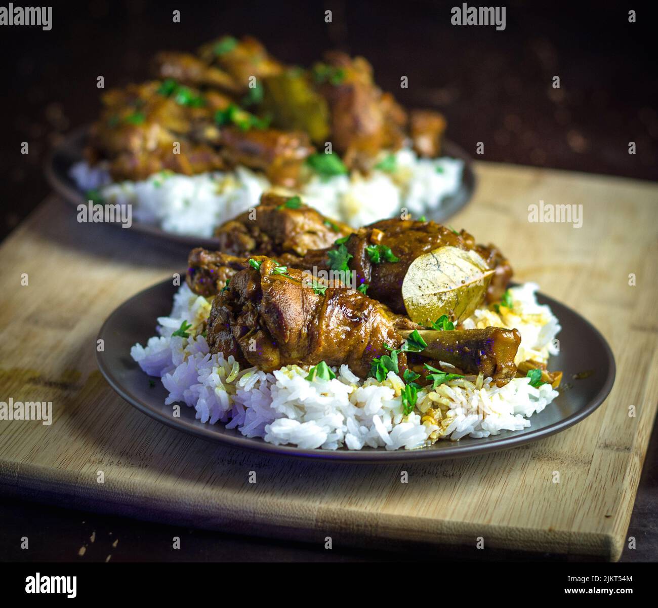 chicken adobo over a bed of rice Stock Photo Alamy