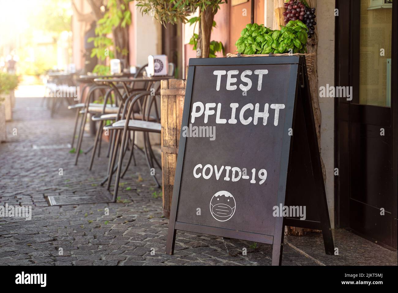 Board In Front Of A Store, Restaurant, Bar Or Cafe With The Inscription Compulsory Testing, Covid-19 Coronavirus Compulsory Testing, Rapid PCR Test Ic Stock Photo