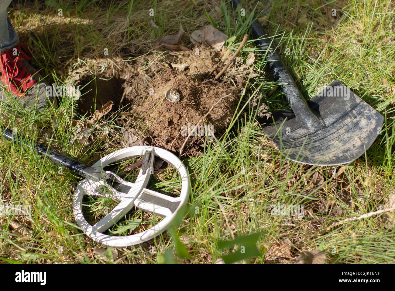 a metal cork from a bottle found with a wireless metal detector on a ...