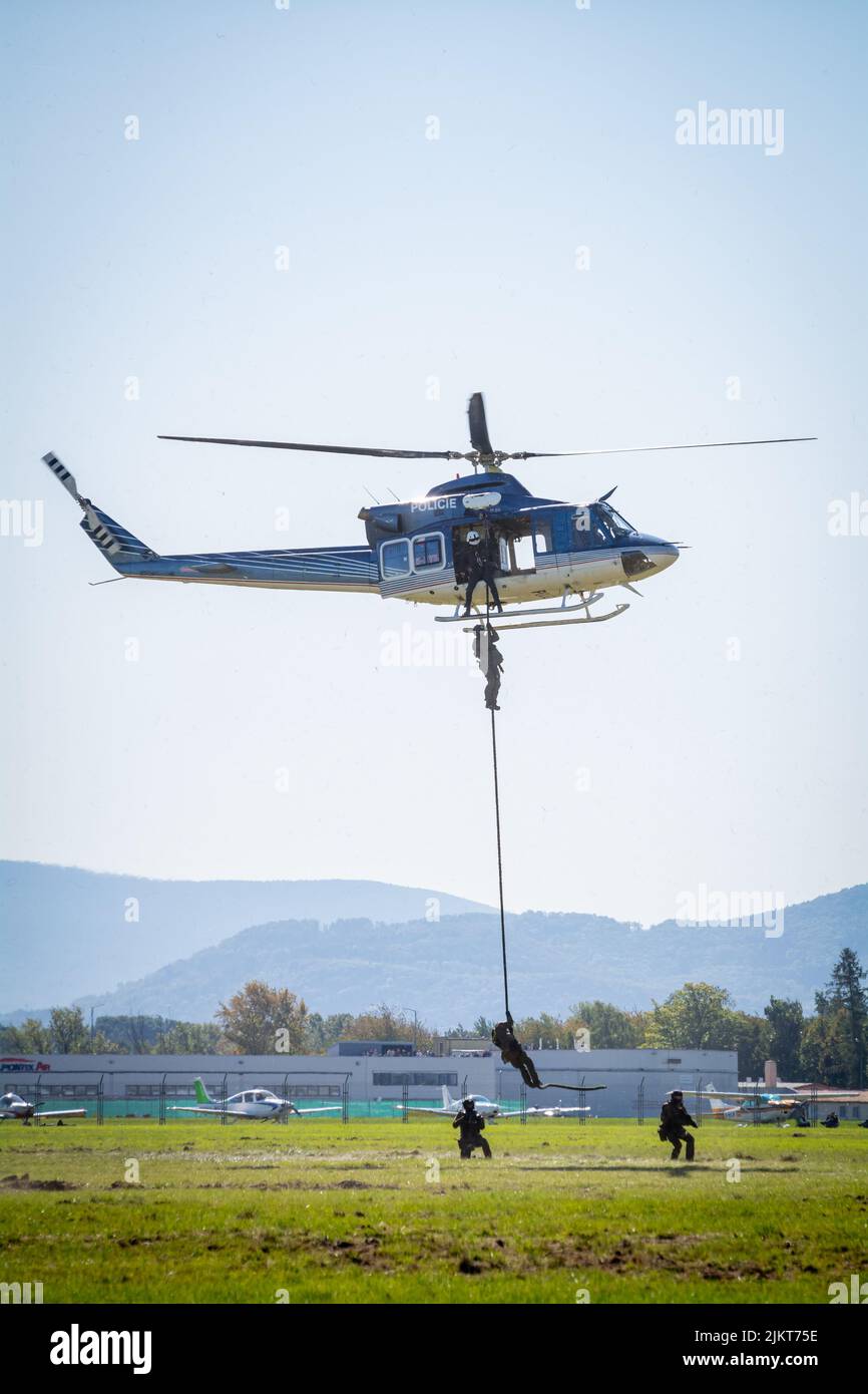 NATO Days, Ostrava, Czech Republic. September 22nd, 2019:   Czech police helicopter Bell 412, tactical police units jump and rappel from helicopter Stock Photo