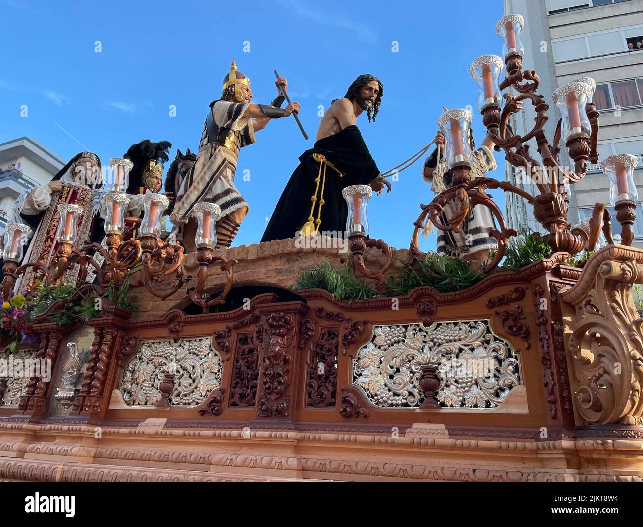 A low angle shot of statues depicting the passion of Christ in a