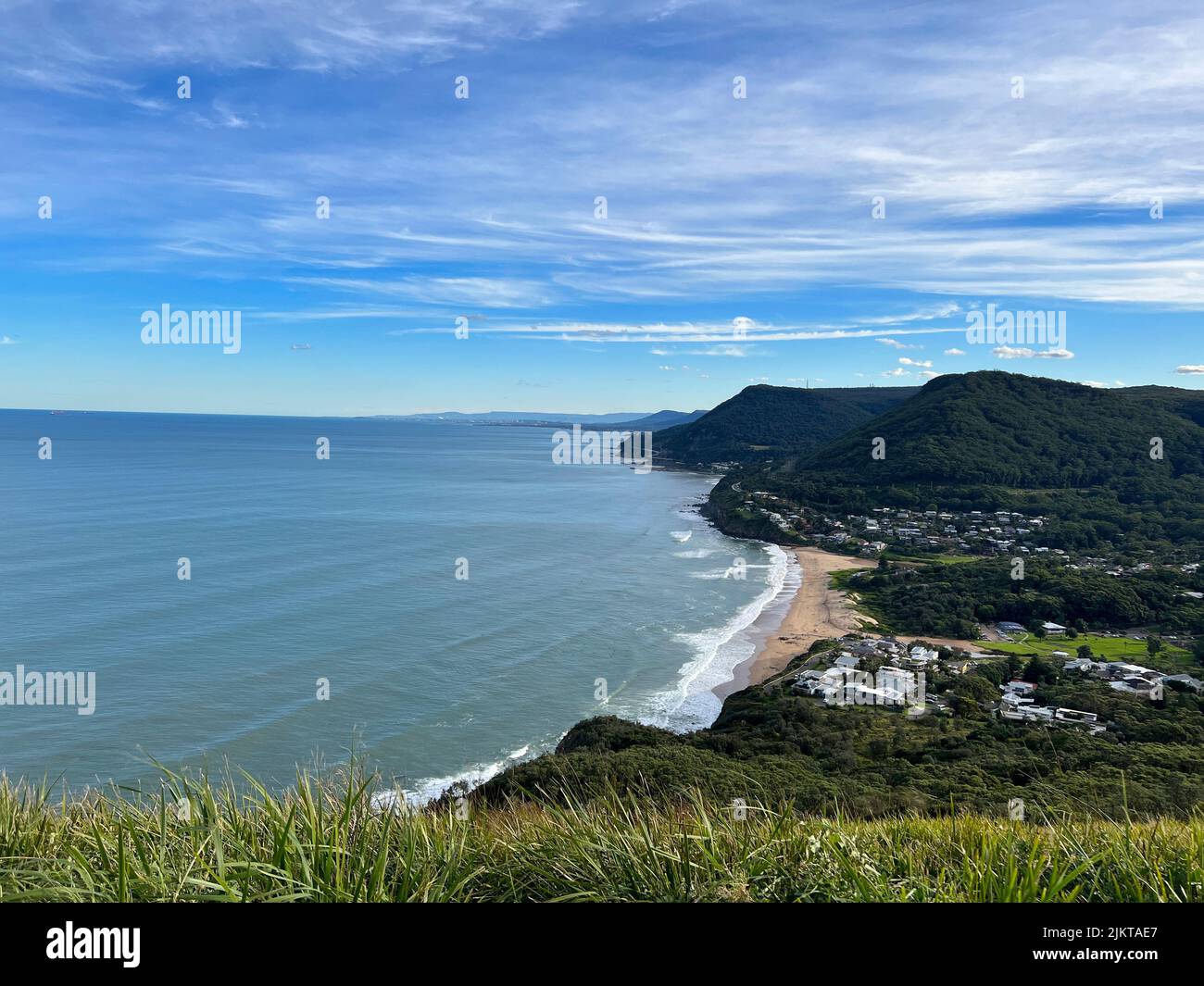 Scenic view of the coastline of Stanwell Park from Bald Hill Lookout, New South Wales, Australia, on the blue sky background Stock Photo