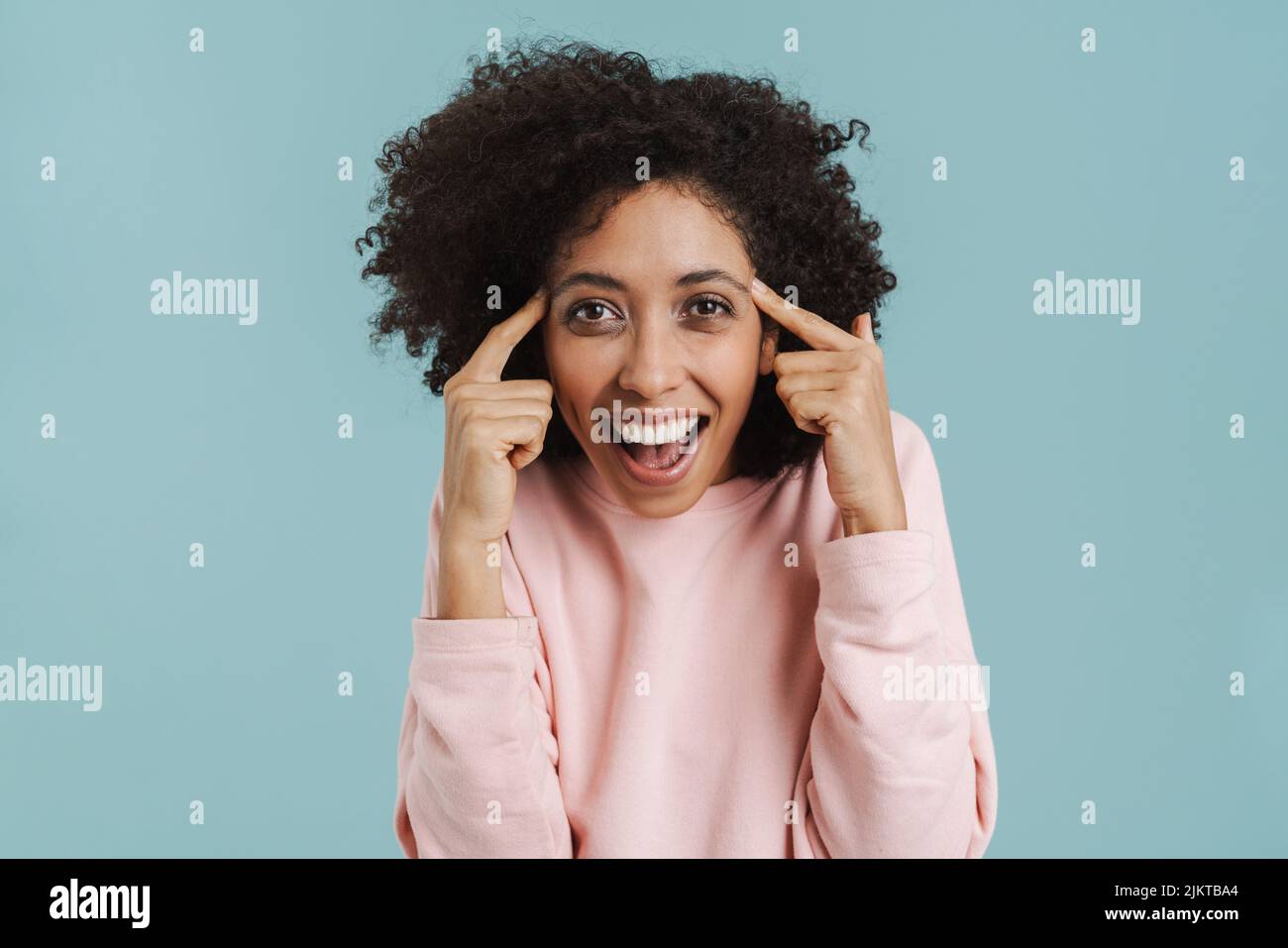 Young woman temples finger hi-res stock photography and images - Alamy