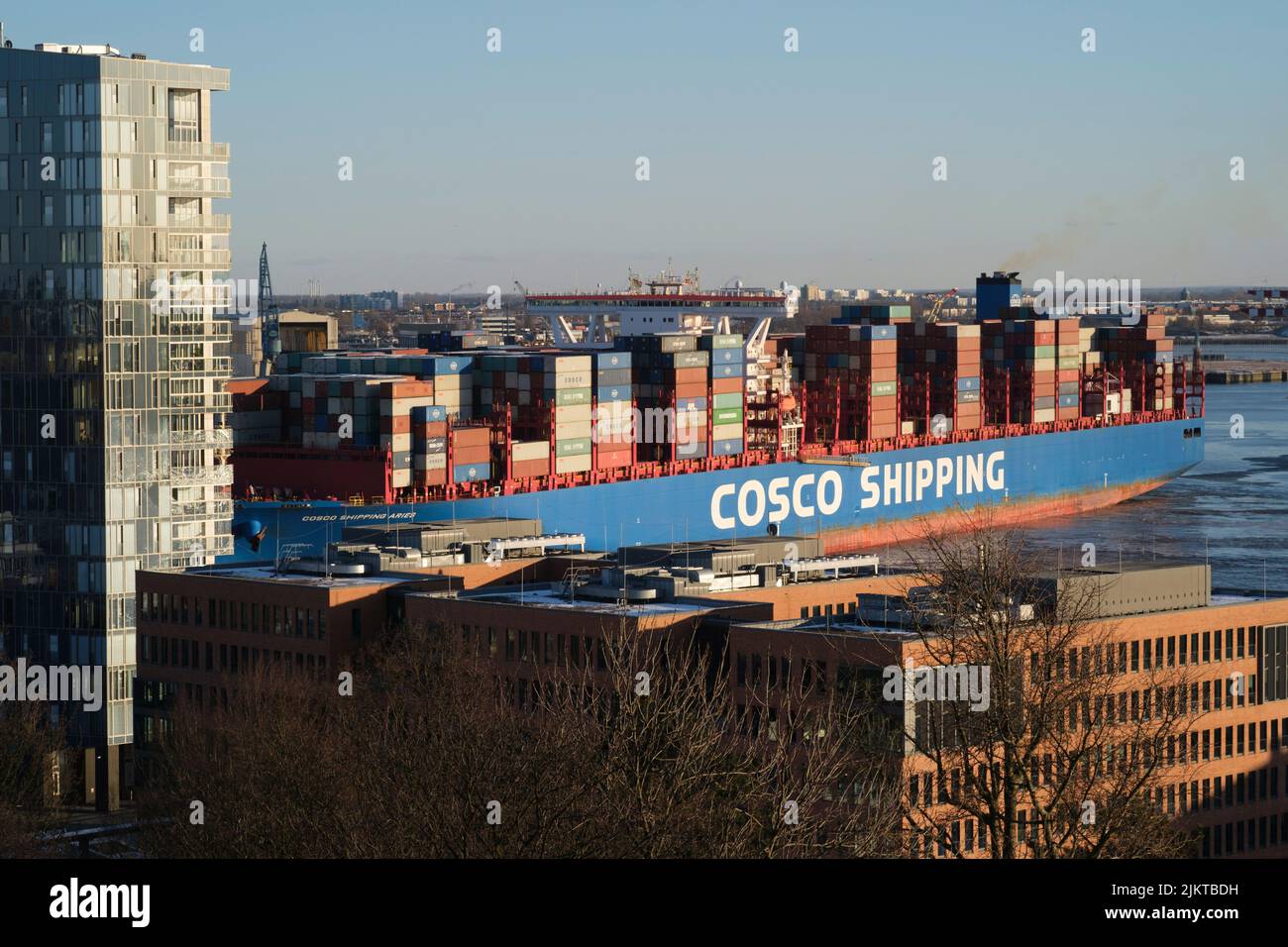 A Cosco Shipping boat in Hamburg Harbor, Germany Stock Photo