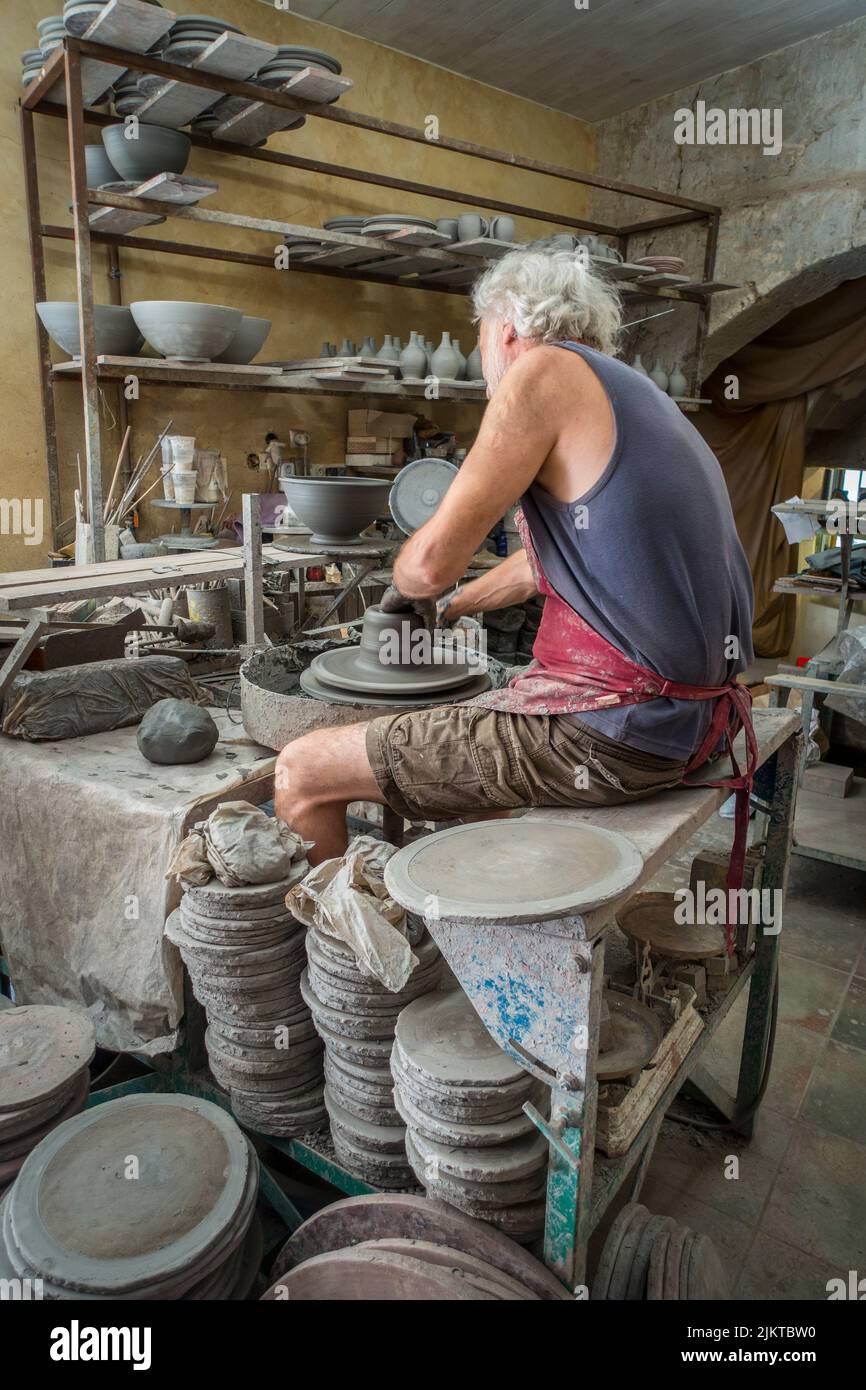 potter at work, St. Quentin La Poterie, France. Stock Photo