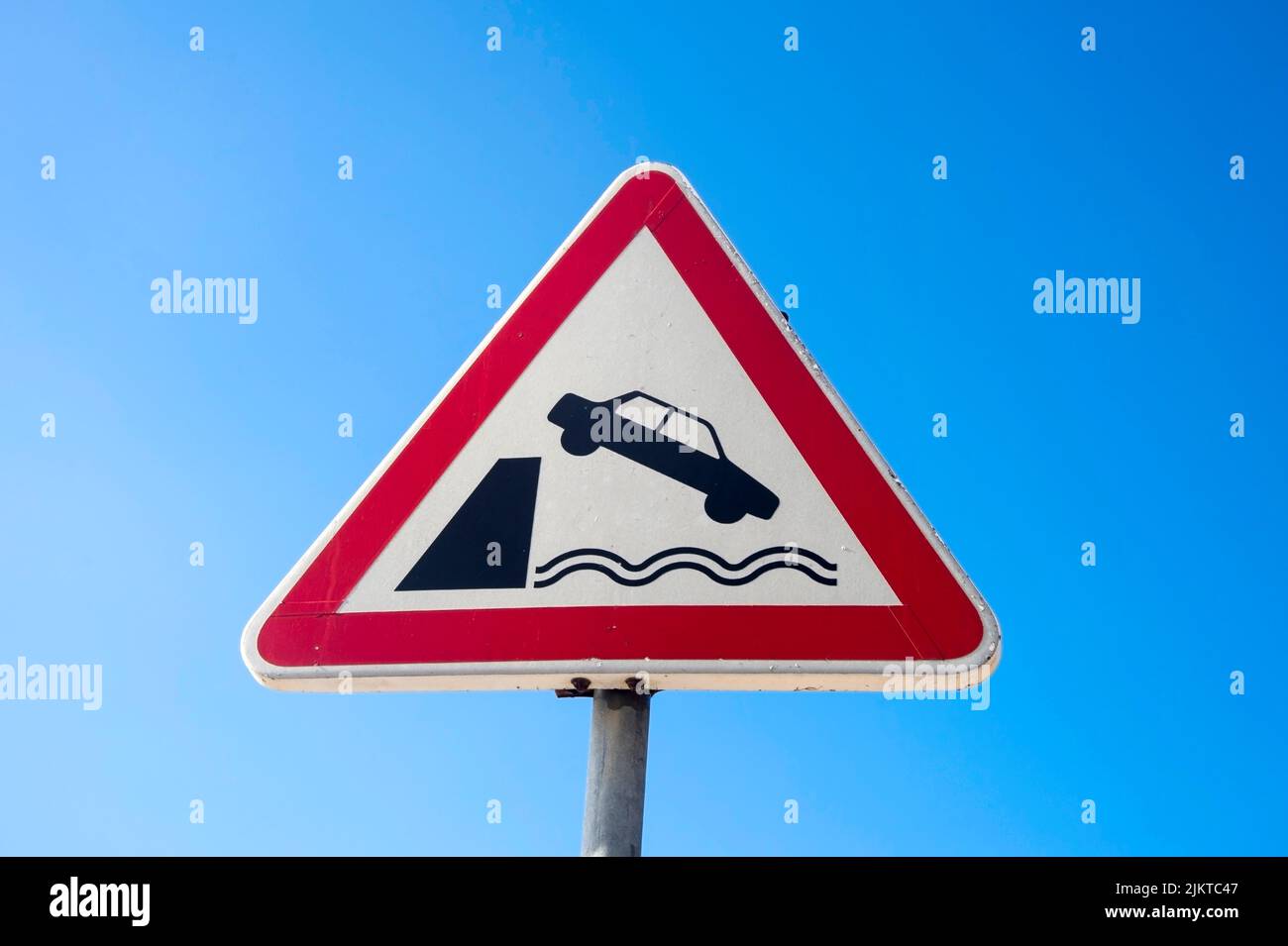 Car falling into water traffic sign Stock Photo