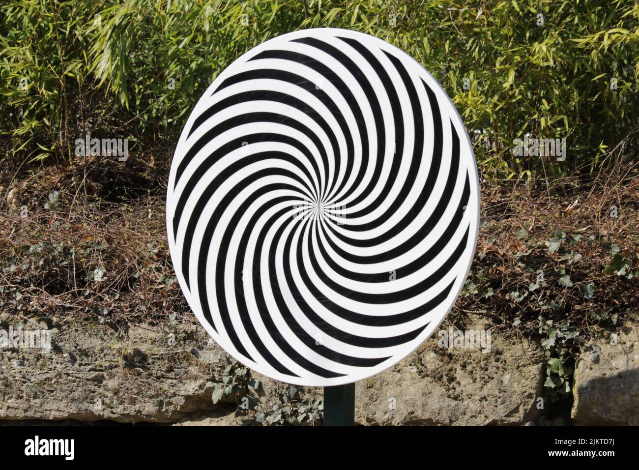 Optical illusion spiral wheel with a natural background Stock Photo