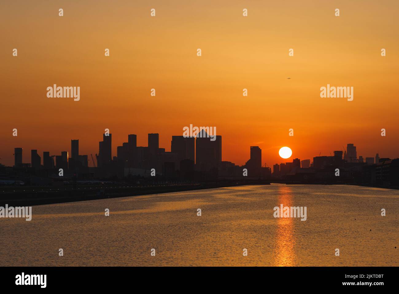 A panoramic view of a sunset over the city next to the sea Stock Photo