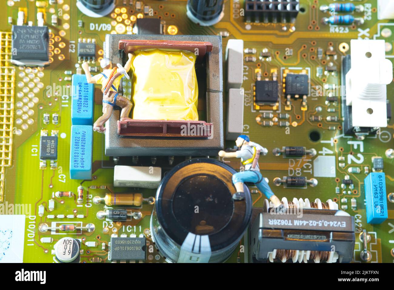 view of two climbers climbing on an electronic circuit board Stock