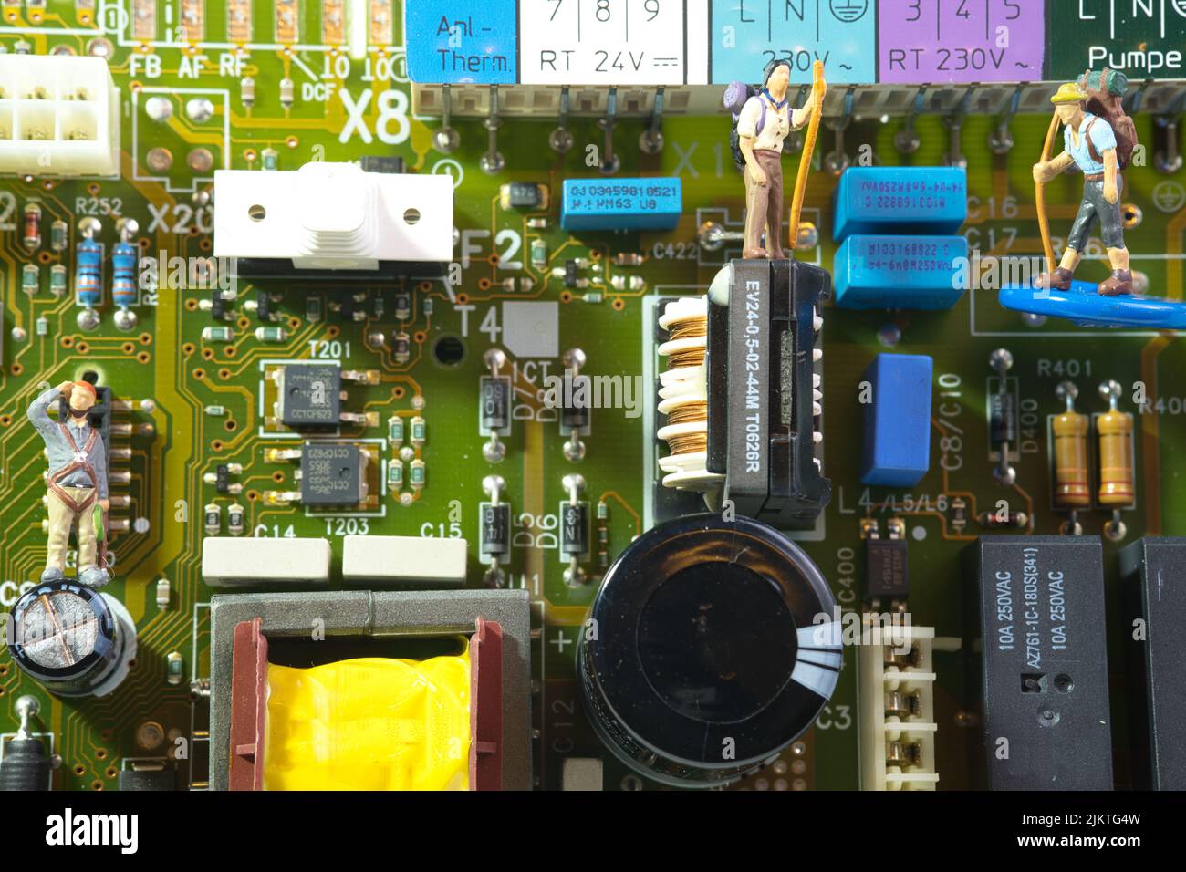 a hiking team on an electronic circuit board, closeup Stock Photo