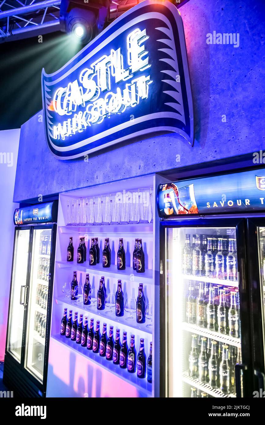 A vertical shot of bottle coolers with illuminated blue light in the