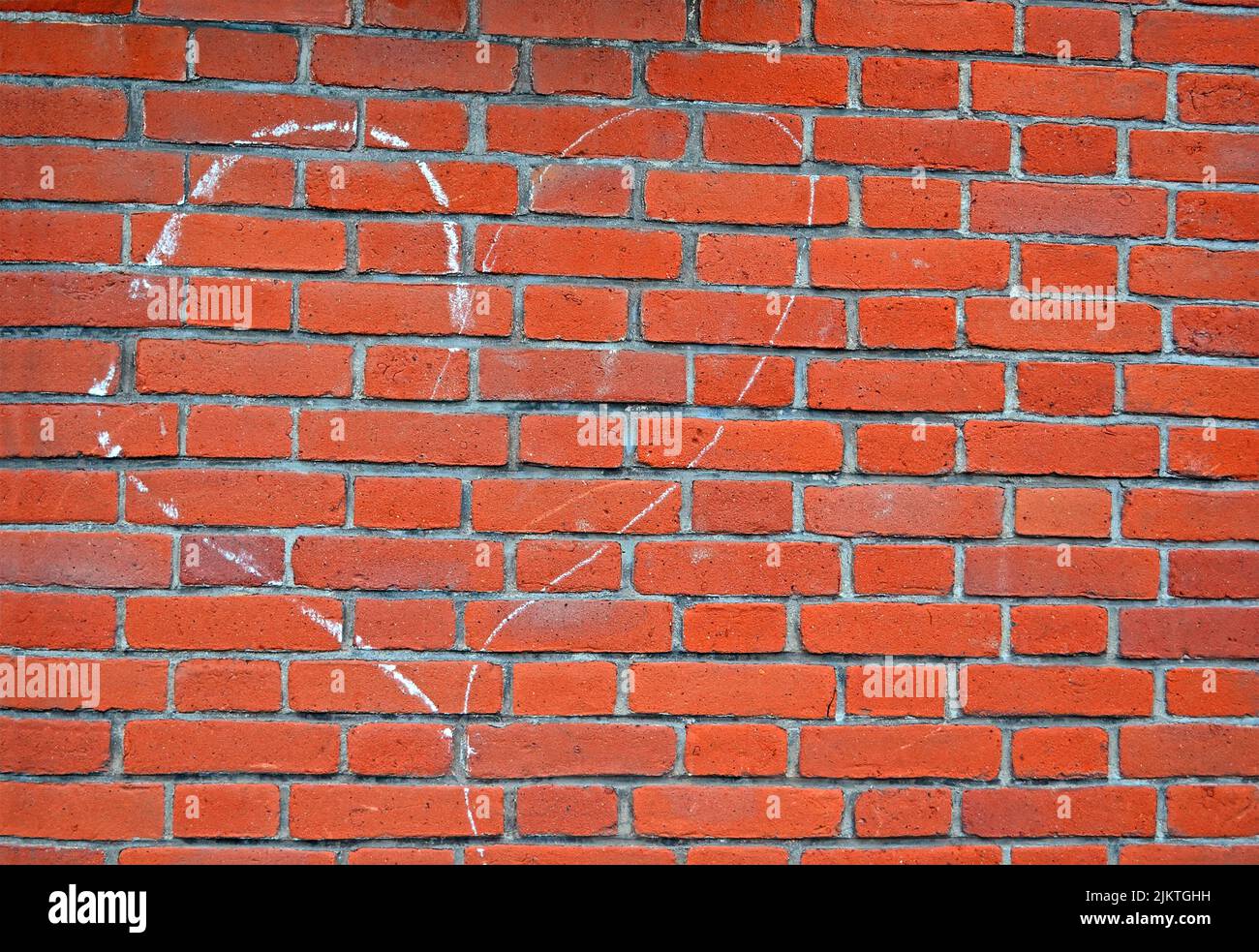 heart sign drawn by white chalk on red brick wall, love diversity Stock Photo Alamy