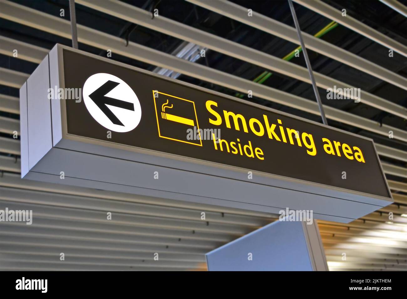 smoking place sign on big airport signboard, bigboard travel diversity Stock Photo