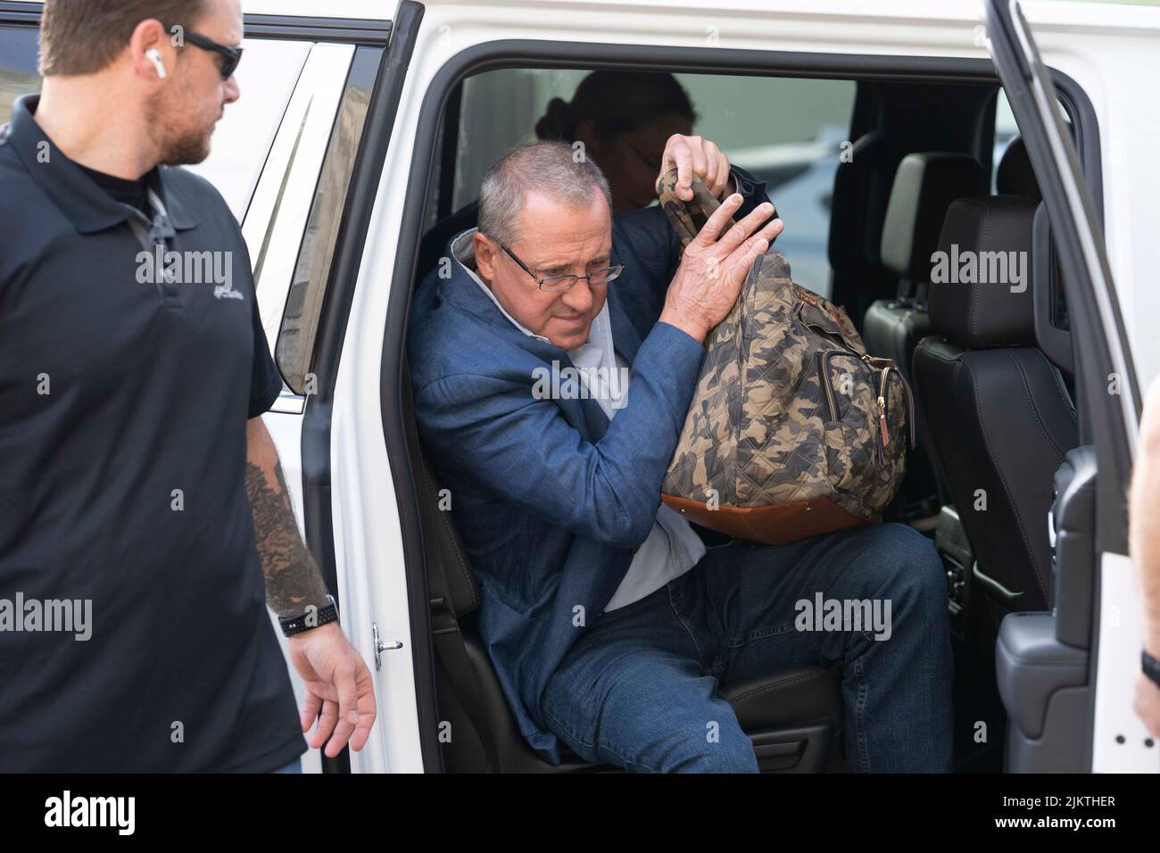Flanked by heavy security, father NEIL HESLIN arrives at the Travis County Courthouse in Austin for day 7 of the Alex Jones defamation trial with Sandy Hook survivors on August 3, 2022. Hslin's son, Jesse was killed in the 2012 Sandy Hook school massacre. Credit: Bob Daemmrich/Alamy Live News Stock Photo