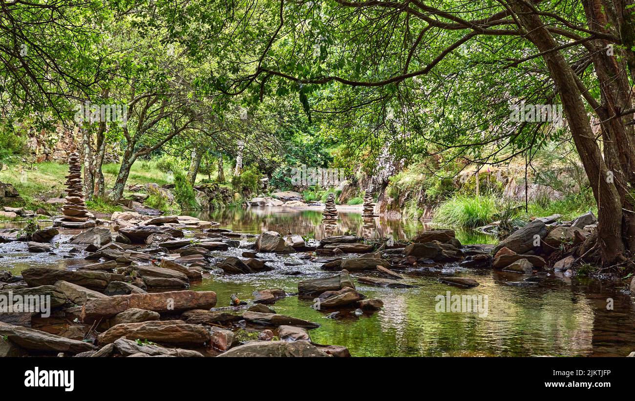 A beautiful shot of the Paiva river full of balanced rocks in the Arouca Geopark on a sunny day Stock Photo