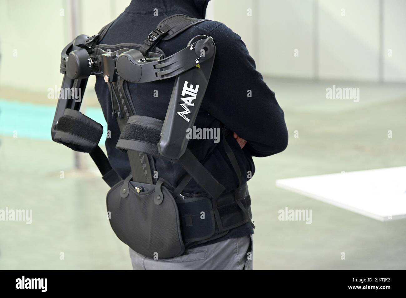 A closeup of a Comau Exoskeleton on a person in Turin, Italy Stock Photo