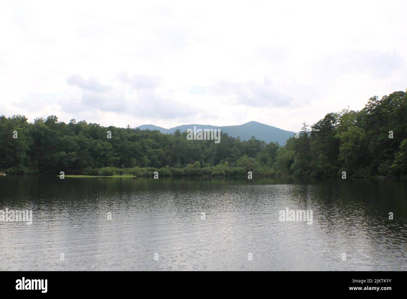 A lake Powhatan with the mountains of Asheville North Carolina in the