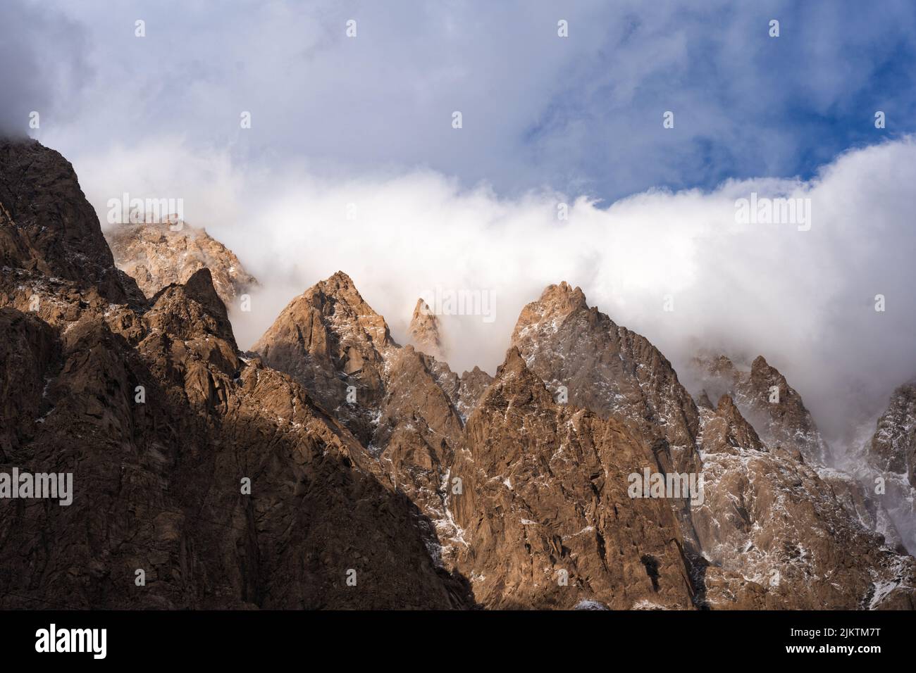 The beautiful view of the mountain peaks against the sky. Stock Photo