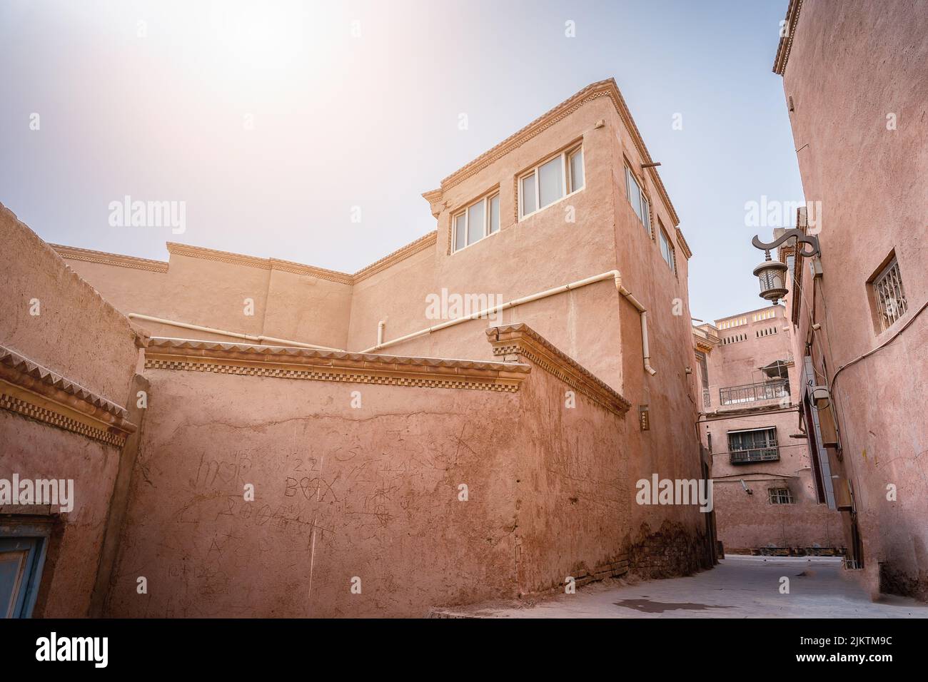 The narrow street with brown stone buildings. Central Asia. Stock Photo